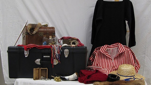The contents of the David Thompson and the Fur Trade traveling trunk are displayed.