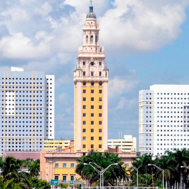 Front view of Freedom Tower. Building with one large tower of more than ten floors.