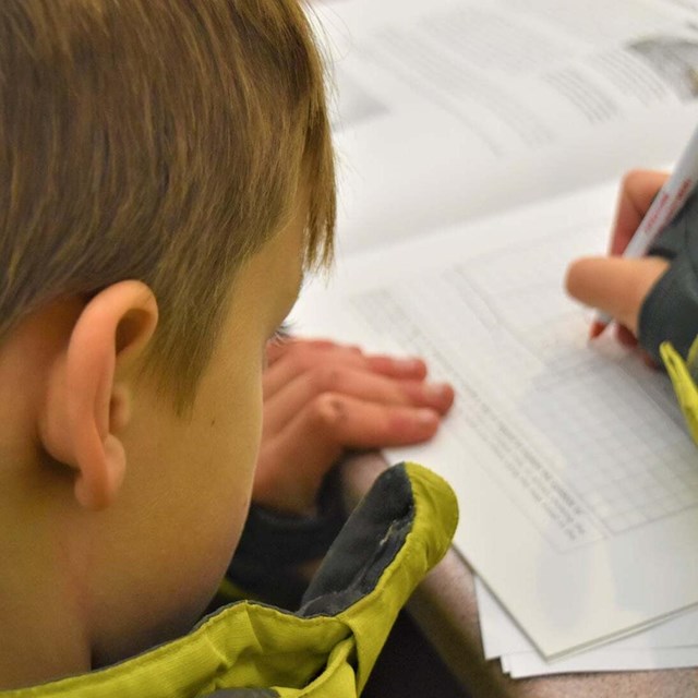 A child writing in a book