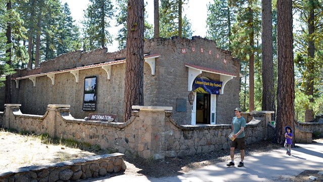 sidewalk leading to a historic stone building