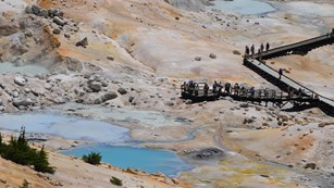 Hikers on the boardwalk in Bumpass Hell basin