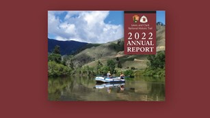 2022 Annual Report. Park Service Logo. Lewis and Clark Trail logo. photo people rafting