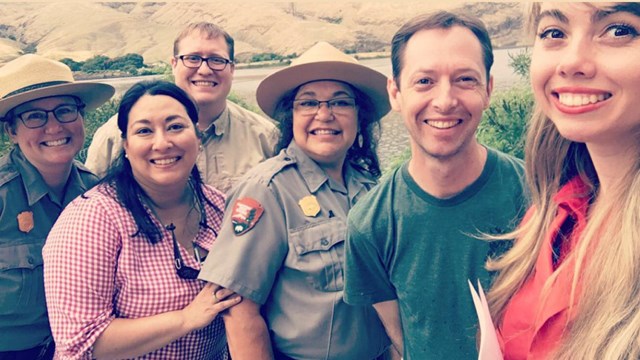 group of people pose for selfie