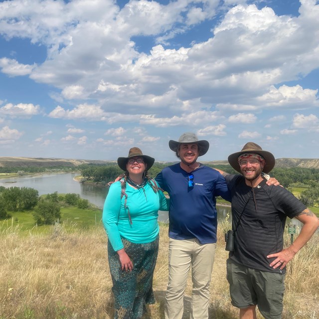 three people in a field