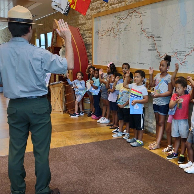 a park ranger with a group of children