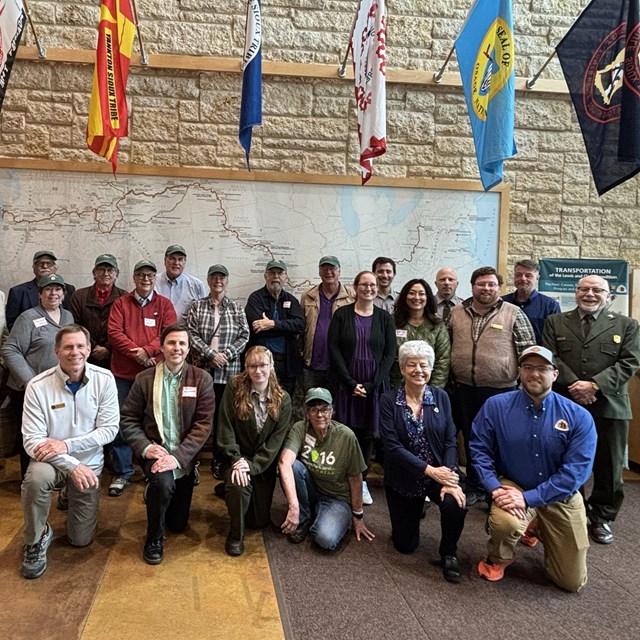 a group of people beneath various flags