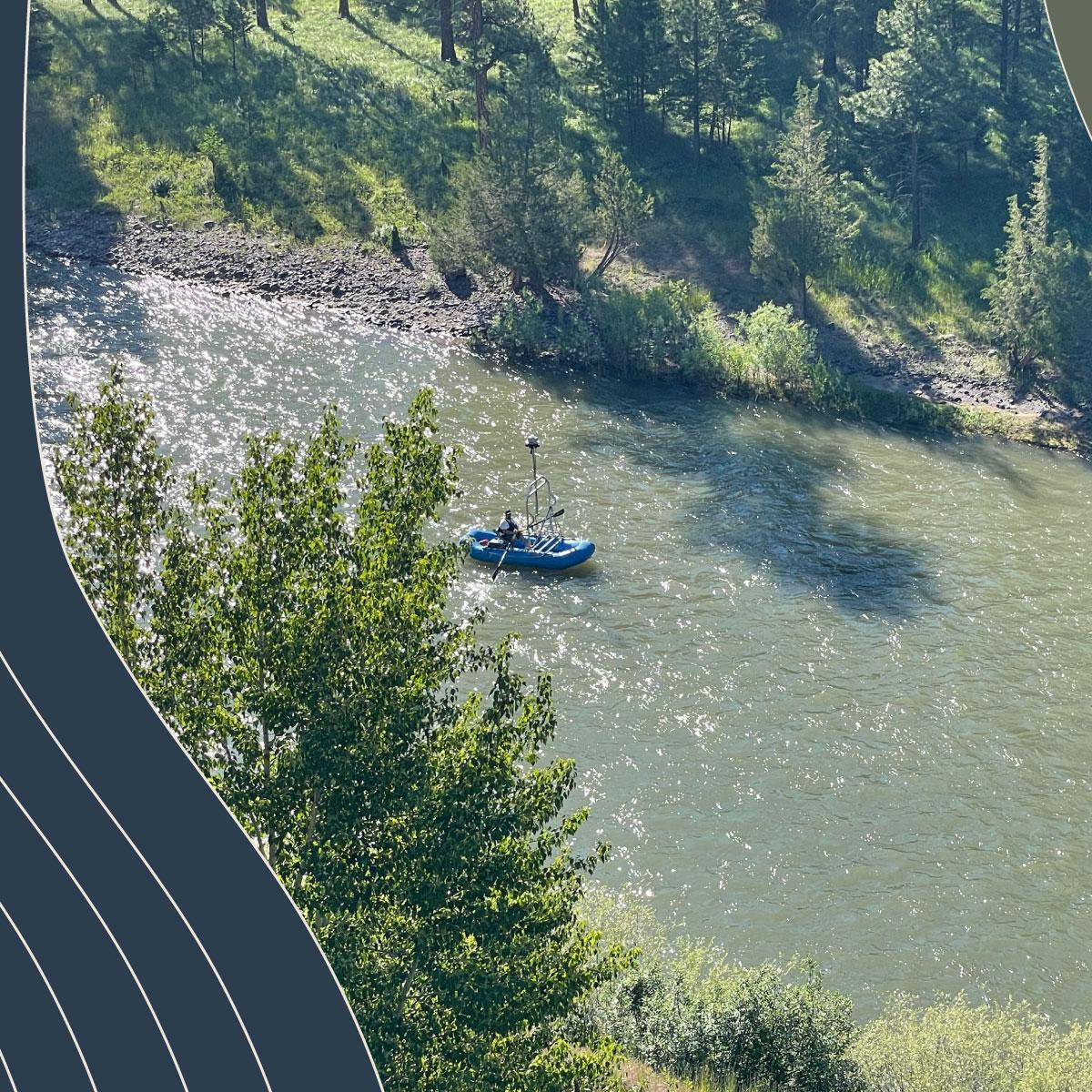 aerial photo of blue rubber boat floats down a river. 