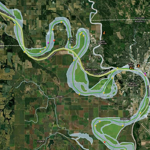 Rich view of satellite map. Missouri River winds through NE, IA, SD. Patchwork of industry, farms