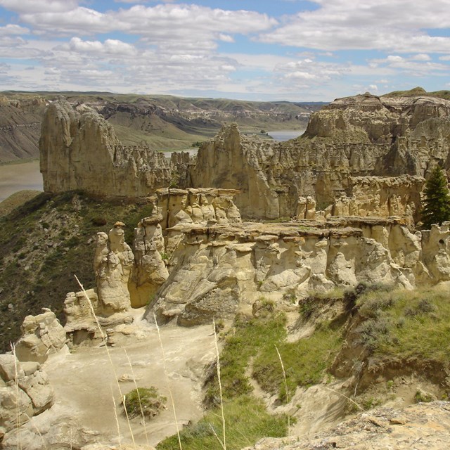 Jagged white cliffs with river in the background