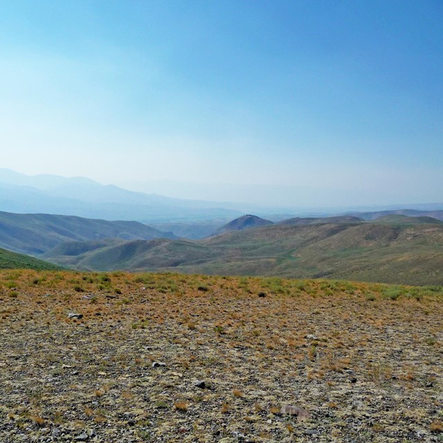 Wide expanse with mountains in the background