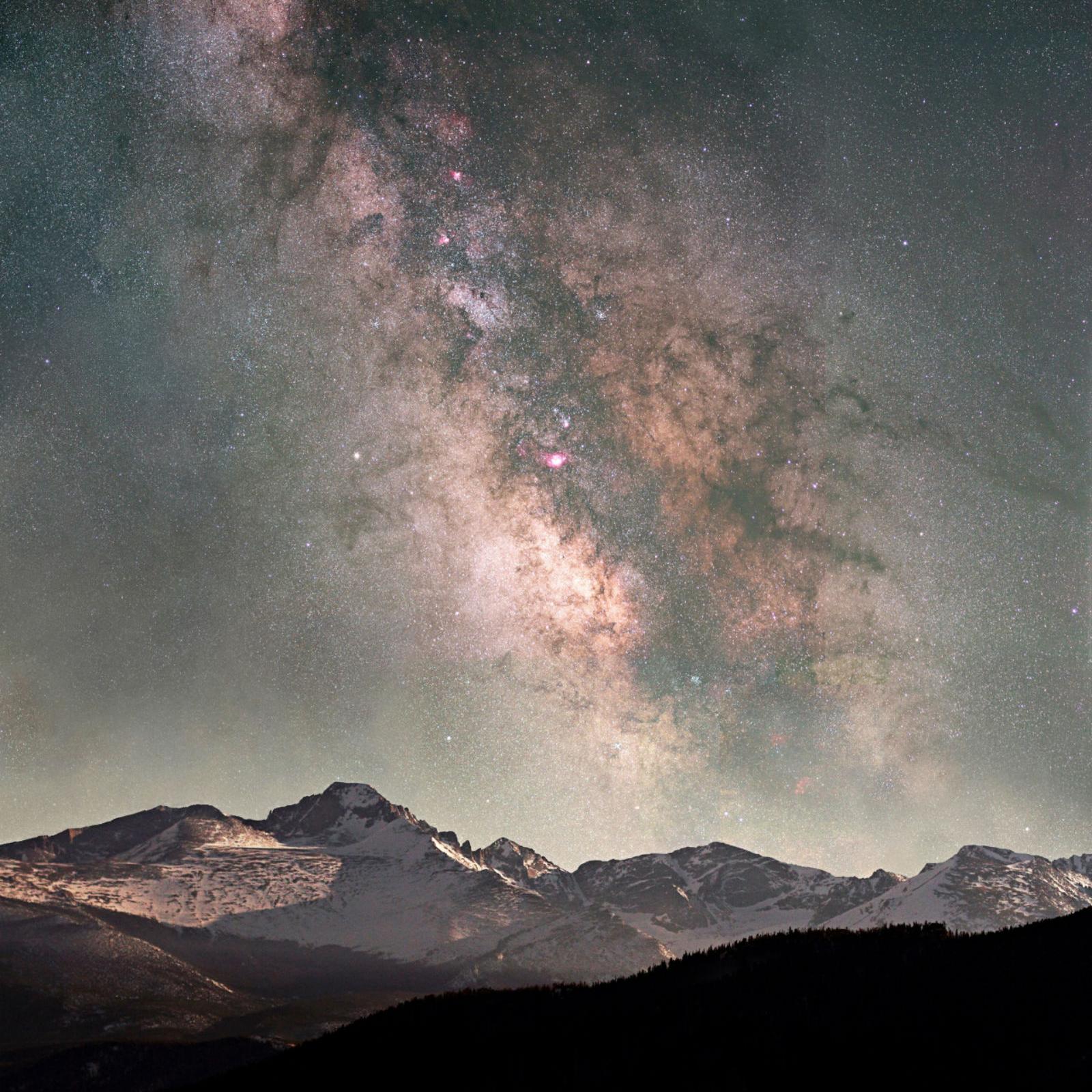 Starry night sky with mountains