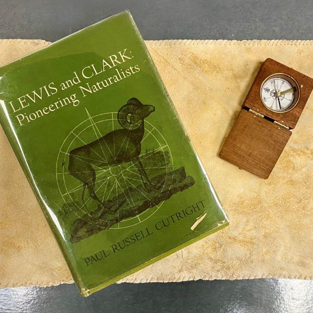 Small green booklet reads Lewis and Clark Pioneering Naturalists