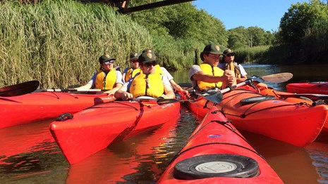 Youth workers kayaking on the river