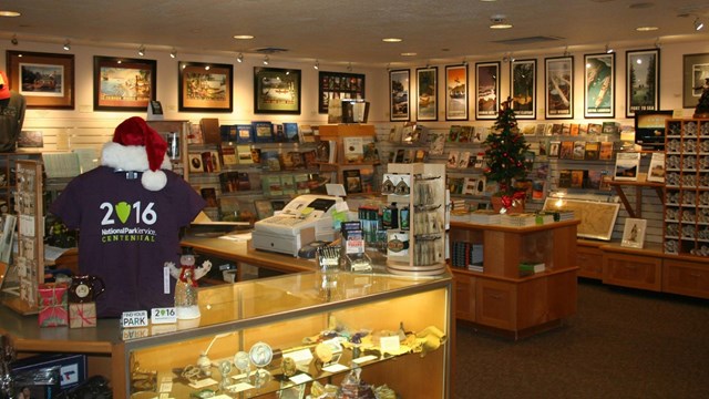 Fort Clatsop Bookstore and glass check out counter with cash registers.