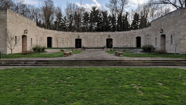 Limestone building with five sculptured panels