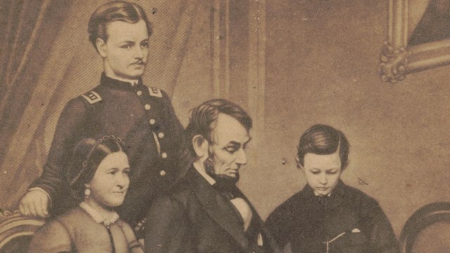 Drawing of Lincoln family, including Lincoln; his wife, Mary; oldest son Robert; and youngest, Tad.