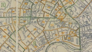 Street map of Cambridge with blocks outlined and numbered in green and orange print