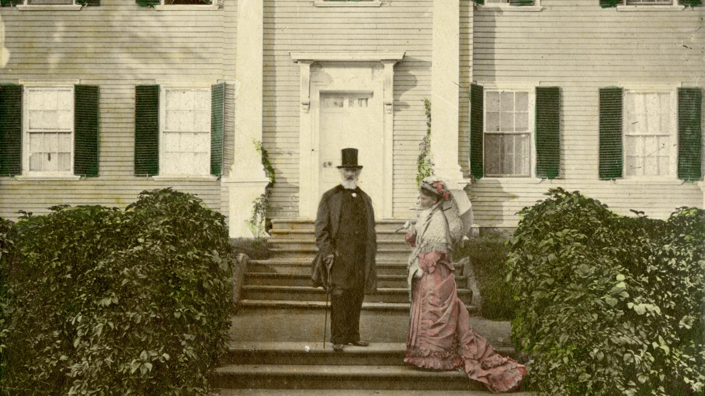Colorized historic photograph of a man and a woman standing in front of Georgian mansion.