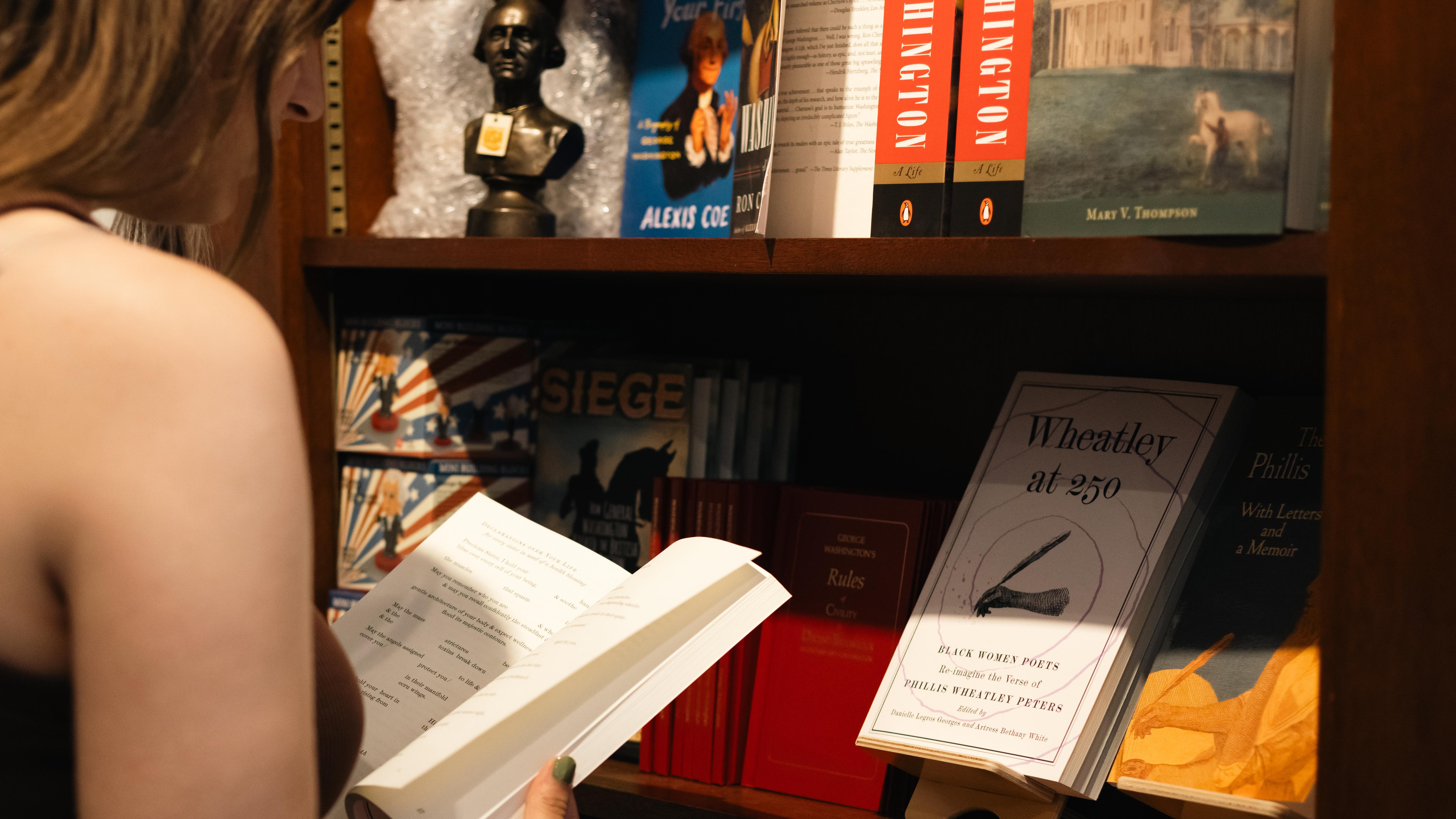 Visitor browsing books in the Visitor Center bookstore
