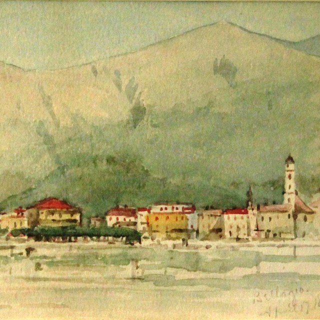 Watercolor landscape of city on far side of lake with large mountains in background