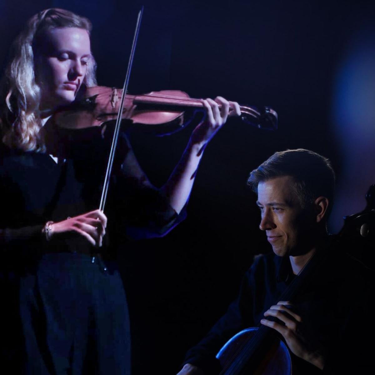 Woman playing a violin and man playing a cello with blue circular graphic in top left corner