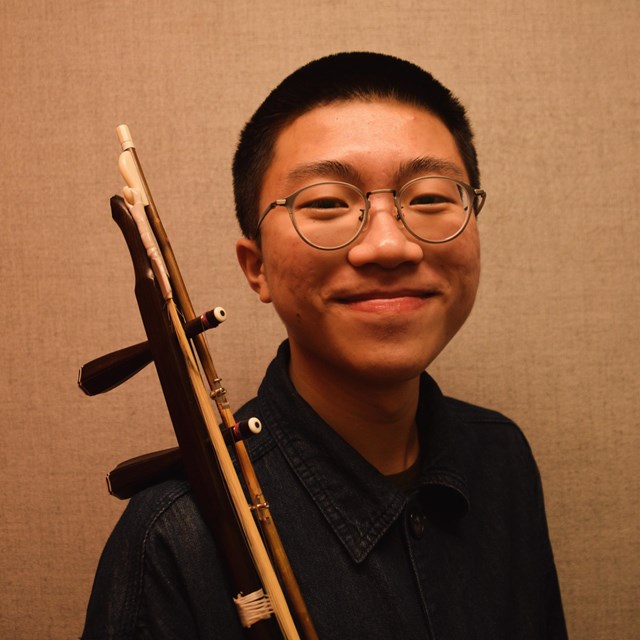 Man smiling with erhu