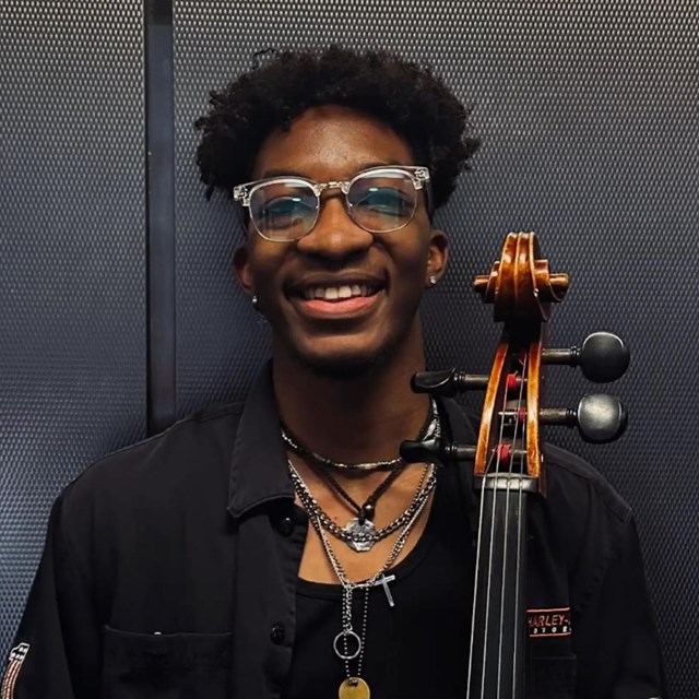 Man smiling with cello
