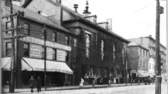 A historic photo of an old mechanics hall in Lowell
