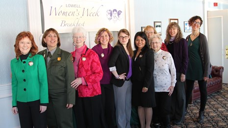 A group of women pose for a photo