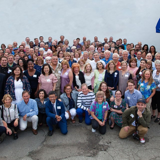 136 individuals posing together. 