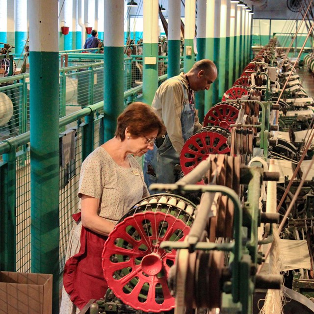 Demonstrators operating the weave room.