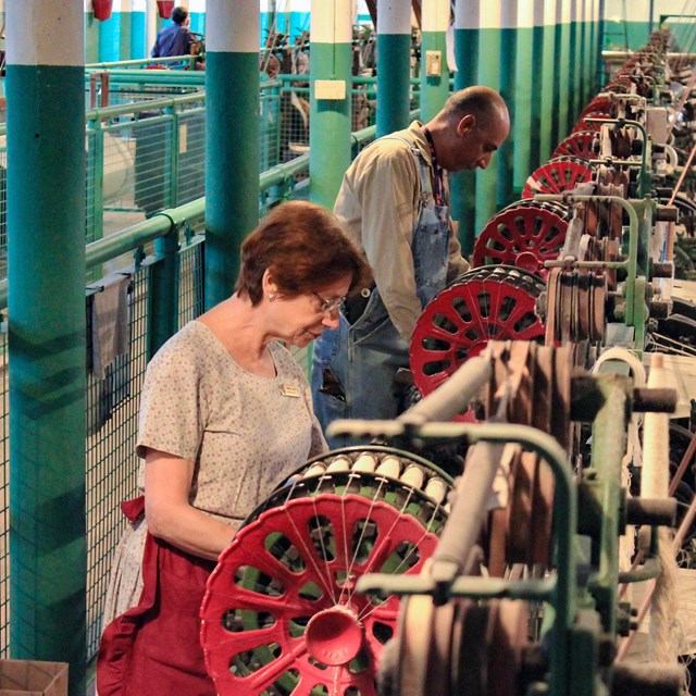 Demonstrators operating the weave room.
