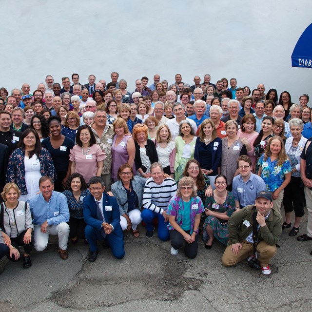 136 individuals posing together. 