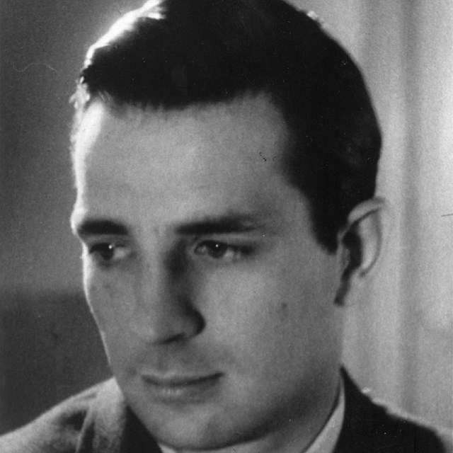 Man facing to the left in black and white photo