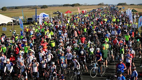 Thousands of cyclists que up at the startline of the LBJ 100 Bike Ride.
