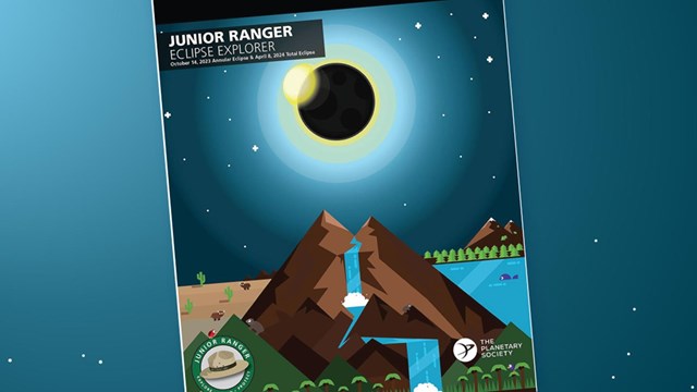 Cover of the Eclipse Explorer Junior Ranger book showing mountains, water, and eclipsed sun.
