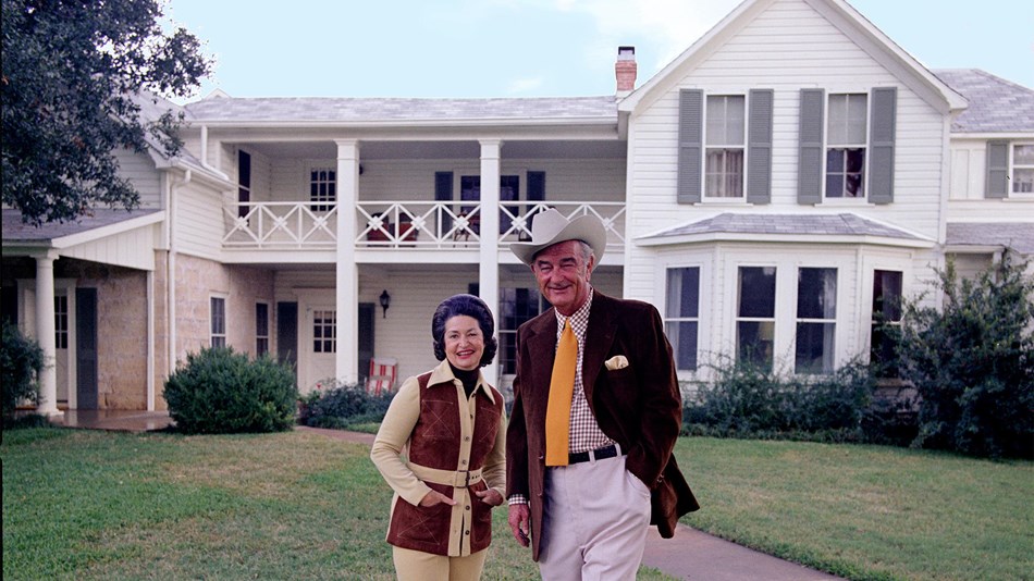 President and Mrs. Johnson pose in front of the Texas White House.