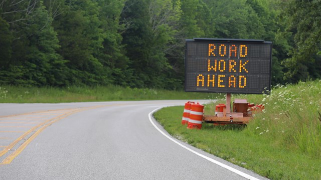 A road work ahead sign