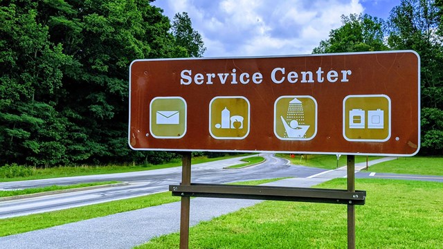 Sign for "Service Center" indicates food, showers, laundry, and a post office.