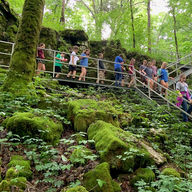 A school group hiking along a trail.