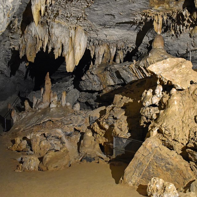 A room in a cave with various stalactites and stalagmites