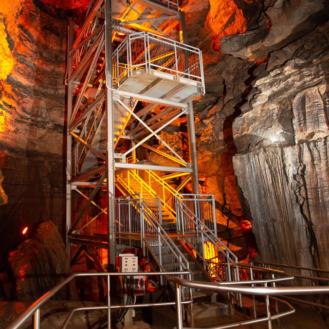 Metal fire tower inside of cave. 