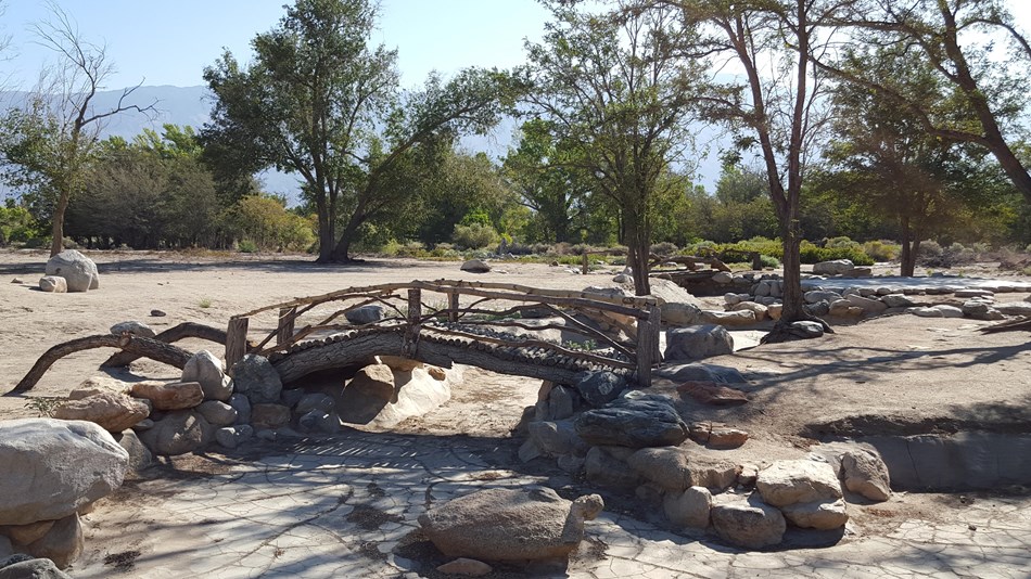 Replica barracks in Block 14 and bridge at Merritt Park
