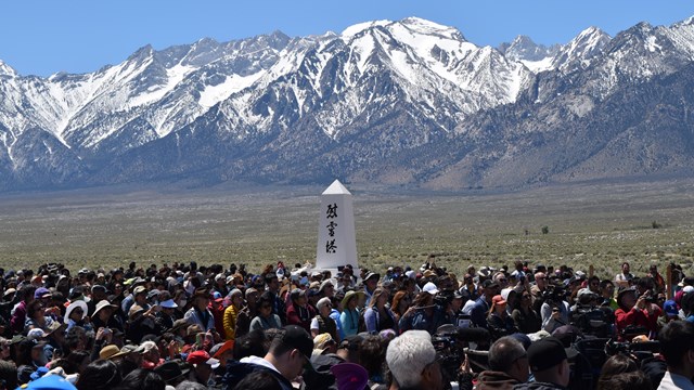 Crowd near the cemetery monument