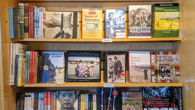 Bookshelf with books about Japanese Incarceration