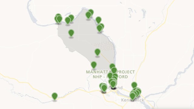 A color map with green markers. The base color of the map is tan. 