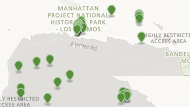 A map of Los Alamos with green pins showing points of interest.