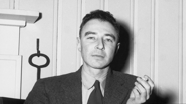 A black and white photo of J. Robert Oppenheimer as a young man.