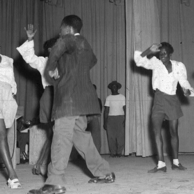 Several people dancing indoors.