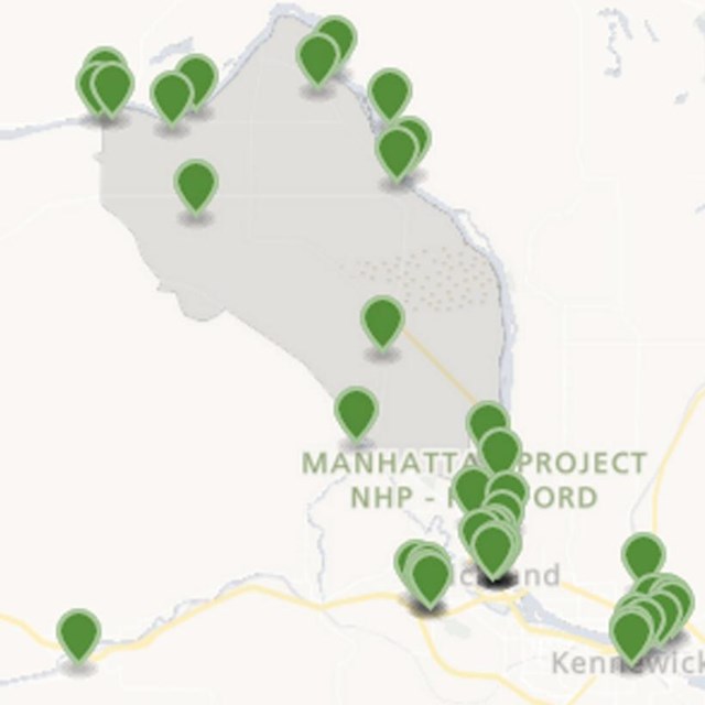 A color map with green markers. The base color of the map is tan. 
